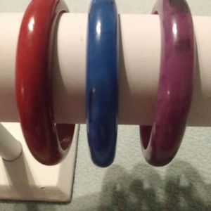 Fakelite bangle stack red violet blue.